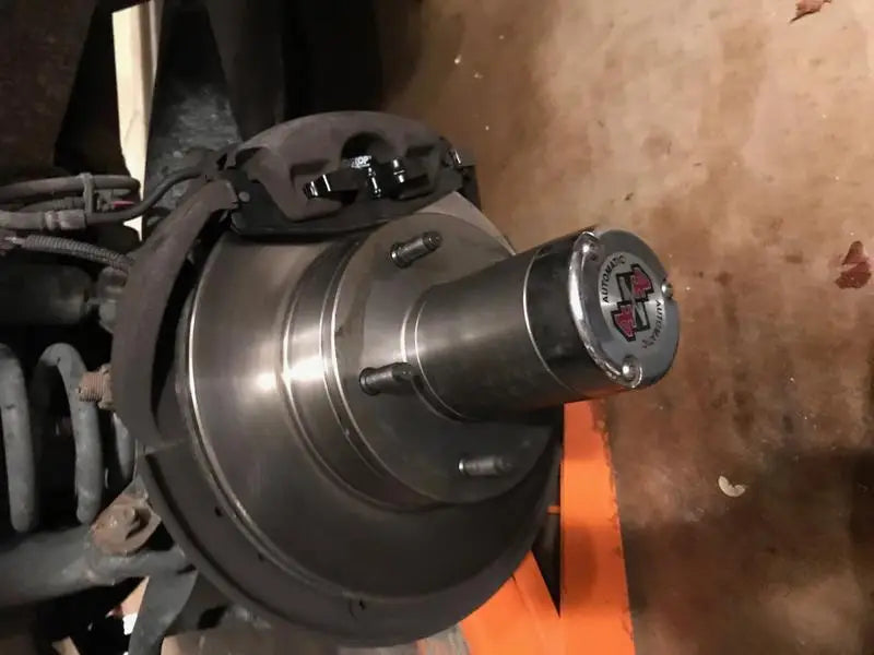 Vehicle brake assembly with PGD953C R/M Brakes Ceramic Disc Pads showing ceramic disc pads