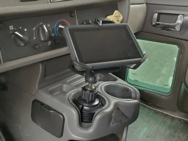 Tablet mounted in a vehicle’s cup holder using Havis Cup Holder for 7-9 inch devices