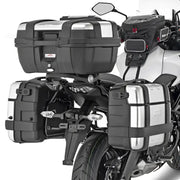 Motorcycle with matte black hard luggage mounting hardware and silver tank bag