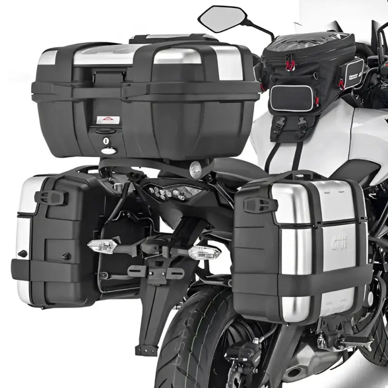 Motorcycle with matte black hard luggage mounting hardware and silver tank bag