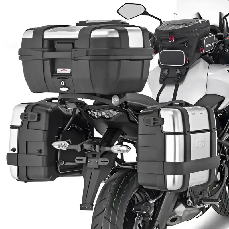 Motorcycle with matte black hard luggage mounting hardware and silver tank bag