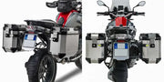 Motorcycle with PL5108CAM Side Case Hardware Outback installed, featuring V35 MONOKEY® SIDE series cases in matte black with red lenses for improved aerodynamics and increased storage capacity.