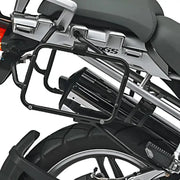 Rear view of motorcycle with matte black luggage mounting hardware and exhaust pipe
