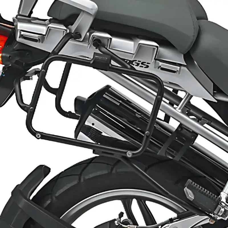 Rear view of motorcycle with matte black luggage mounting hardware and exhaust pipe