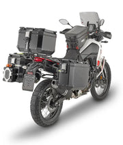 Adventure motorcycle with PLO2145CAM hard luggage mounting hardware and storage cases
