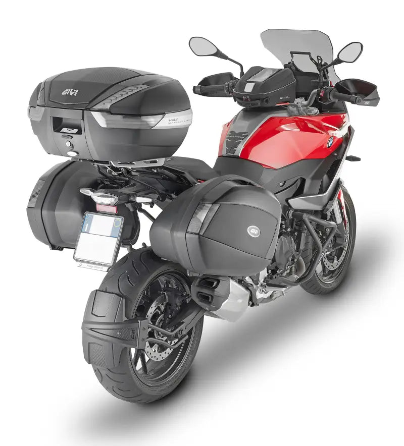 Red and black touring motorcycle with matte black hard luggage mounting hardware for side cases