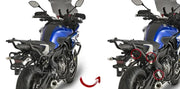 Blue motorcycle with matte black luggage mounting hardware for hard luggage mounting