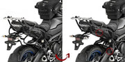 Motorcycle with matte black luggage mounting hardware and soft top bag on racks