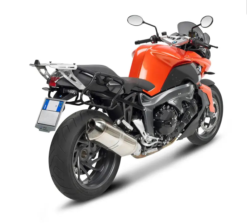 Orange touring motorcycle with matte black hard luggage mounting hardware and saddlebag mounts