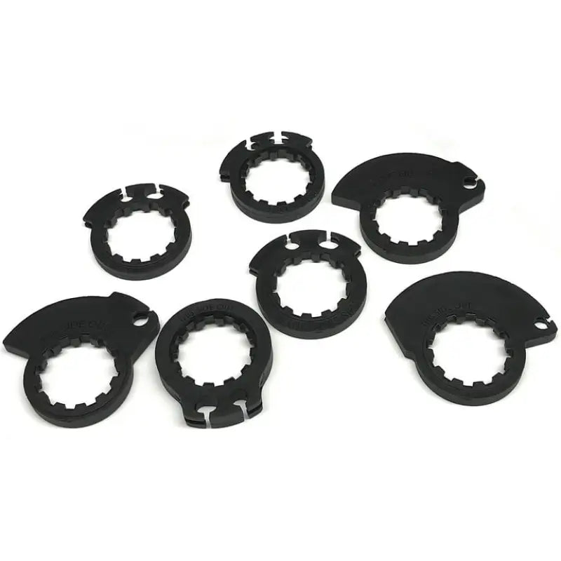 Seven black toothed-ringed semi-circular components perfect for ProTaper Full Diamond Grips in white dark gray