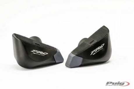 Black and gray motorcycle footpegs with textured surface for Puig 7070N frame sliders