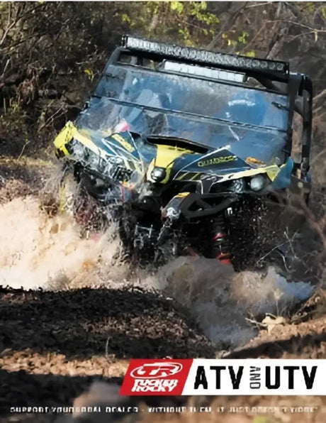All-terrain vehicle splashing through water featuring Suzuki LT-A500F QuadMaster carburetor kit