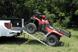 QuadBoss Bifold Ramp 50x72 - 560052 in use, facilitating easy ATV loading onto a white truck in an outdoor setting. Durable, compact, and reliable ramp for effortless equipment and vehicle transport.