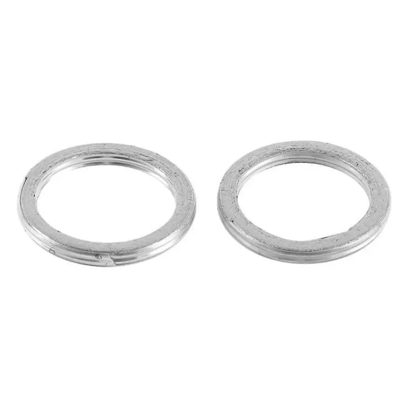 Two silver metal gaskets from the QuadBoss Exhaust Gasket Kit for durable exhaust fit