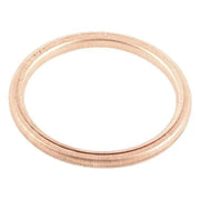 Copper-colored metal ring from QuadBoss Exhaust Gasket Kit for quadboss exhaust systems