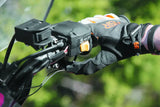 Motorcycle handlebar with gloved hand using QuadBoss Heated Grips with thumb warmer