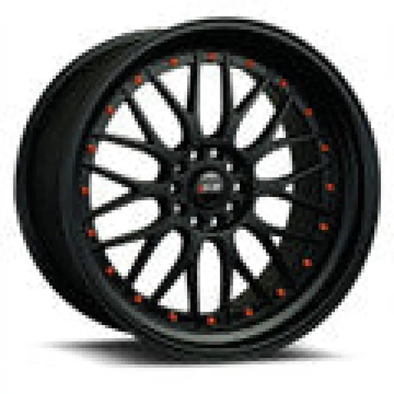 Black multi-spoke car wheel from QuadBoss Qb Full Top End Set boosts ATV’s performance