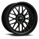 Black multi-spoke car wheel from QuadBoss Qb Full Top End Set boosts ATV’s performance