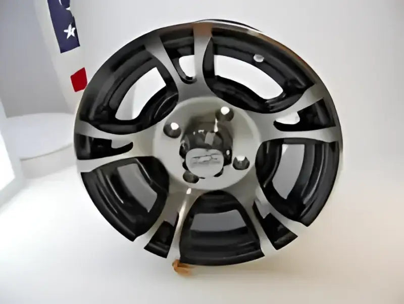 Black and silver aluminum wheel for QuadBoss QBoss Carburetor Kit, looks sleek and stylish
