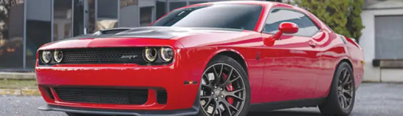Red Dodge Challenger SRT with QuadBoss Qboss Shock Kit for better ride quality