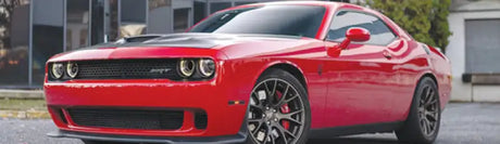 Red Dodge Challenger SRT with QuadBoss Qboss Shock Kit for better ride quality