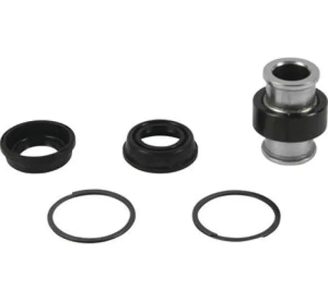 Disassembled bearing assembly from QuadBoss Qboss Shock Kit for easy repair