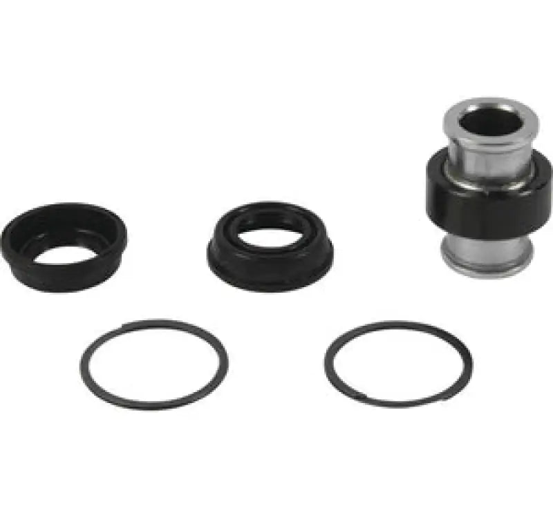 Disassembled bearing assembly from QuadBoss Qboss Shock Kit for easy repair