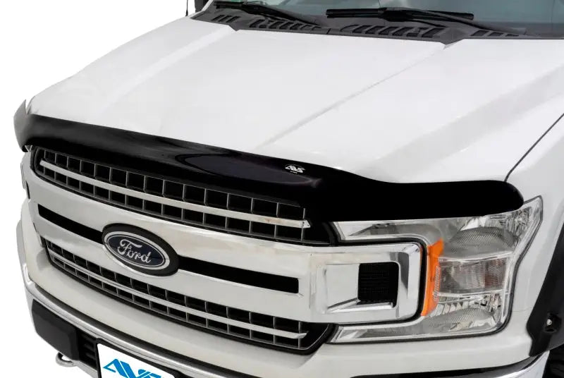 Black bug deflector on white Ford truck with Quadboss Sprocket Hat Hi-Vis for style