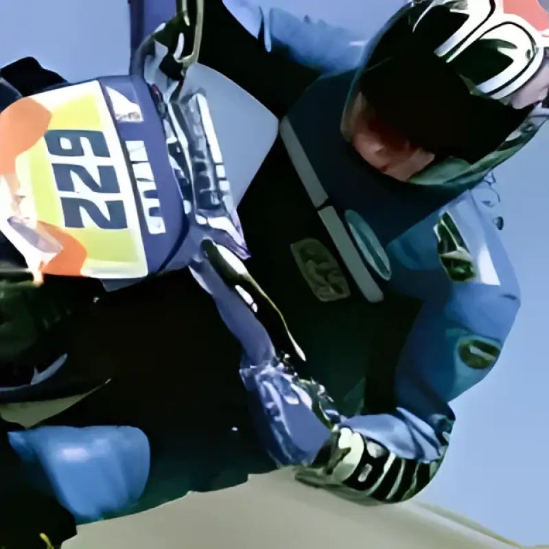 Blue motocross rider wearing Exo-R1 Air full face helmet with face shield and cheek pads