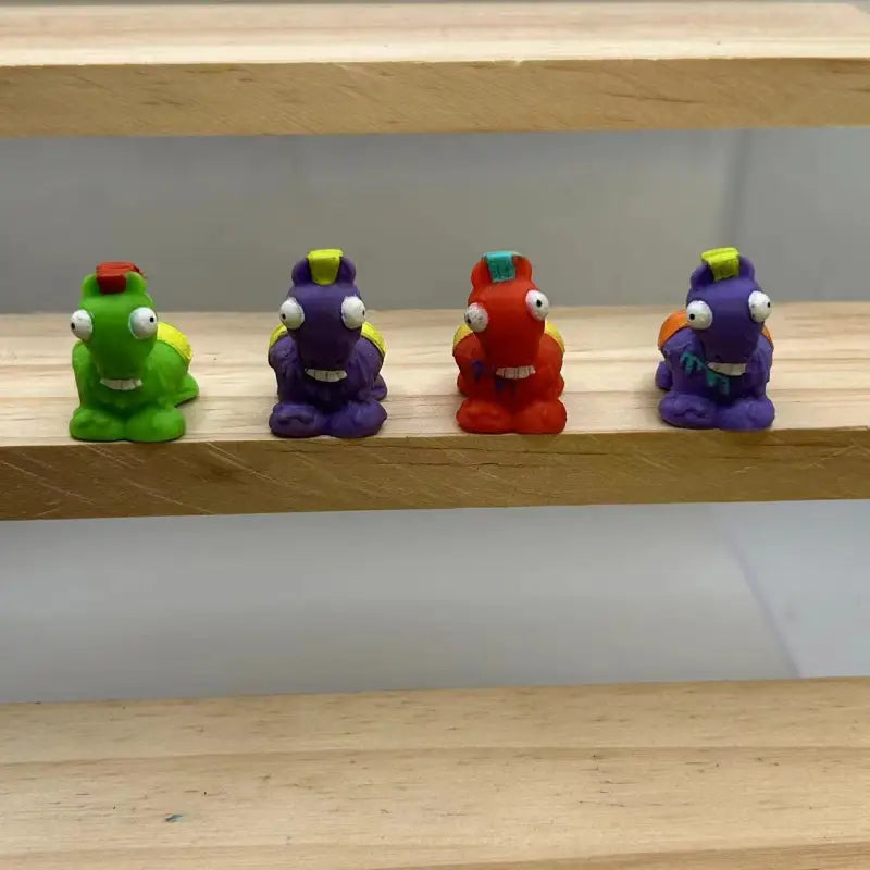 Colorful toy monsters next to R1-1127 Scorpion EXO-R1 Air helmet with face shield