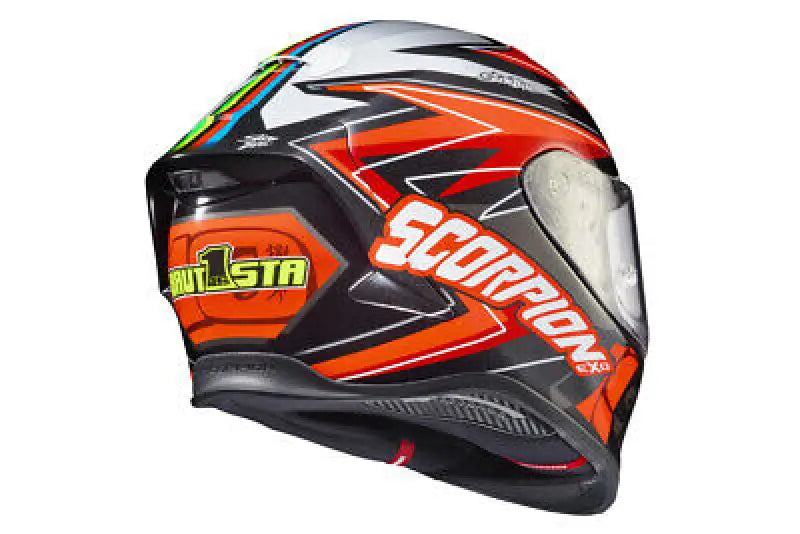 Motorcycle helmet with orange and black graphics, exo-r1 air face shield, cheek pads