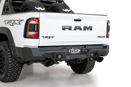 A.Desert Stealth Fighter Rear Bumper on white RAM TRX truck, showcasing rugged ADD Offroad design.