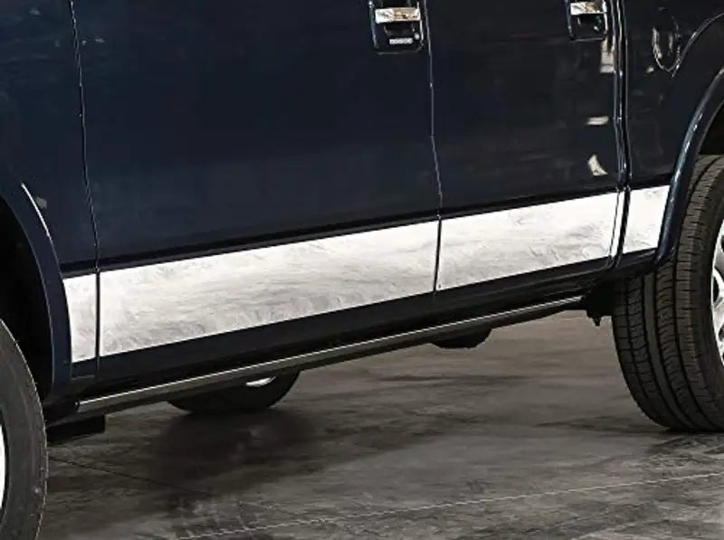 Side view of dark blue truck with chrome trim, abs textured black rock finish