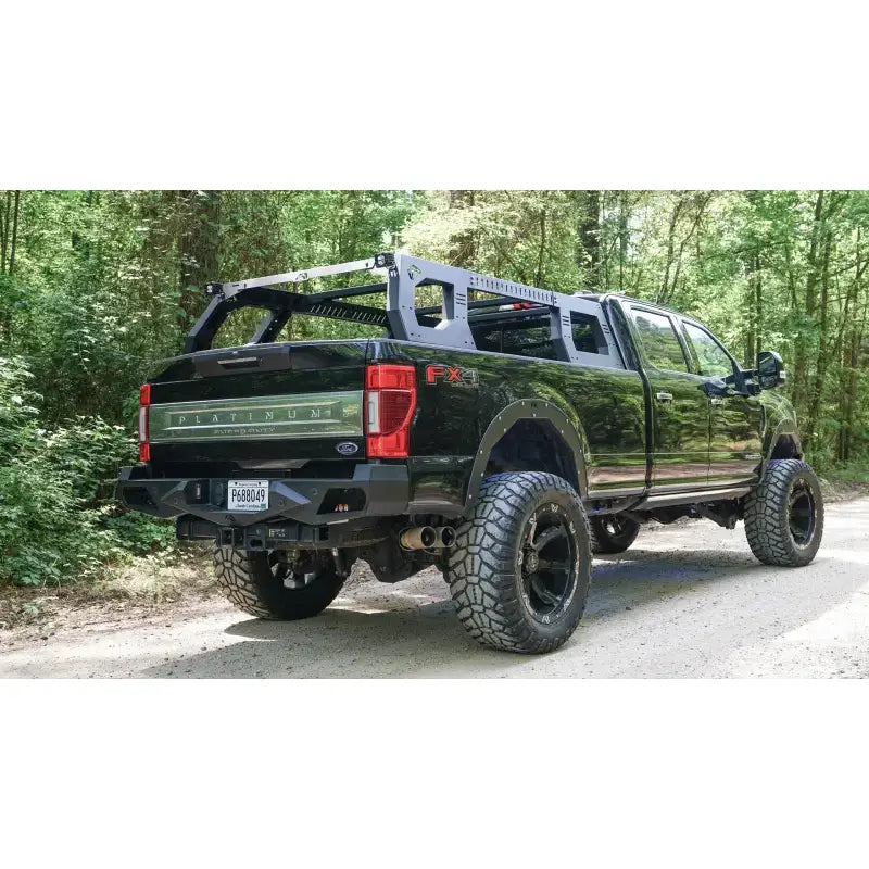 RACK01-01-1 Fab Fours Adjustable Rack System mounted on a black Ford truck, showcasing its durable construction and versatile design for transporting cargo.