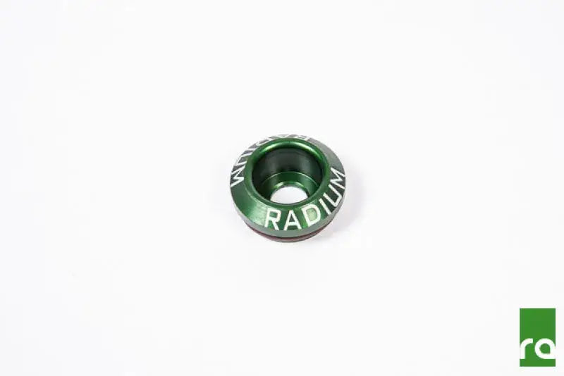 Radium Engineering Subaru Injector Seat 22mm, green anodized aluminum with white engraved logo.