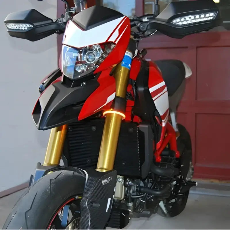 RAGE-360-54 360 Turn Signals 54mm installed on a red and black motorcycle.
