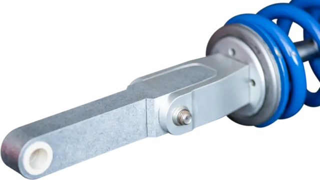 Blue coiled spring and silver shock absorber from Rale Industries Yam Fit Kit