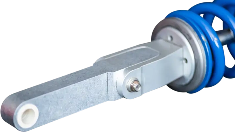 Silver automotive shock absorber with blue spring for Sherco Fit Kit snow bike upgrade