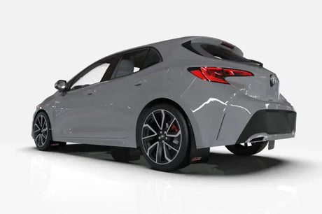 Gray Ford Focus hatchback with rally armor black mud flaps and stylish black wheels