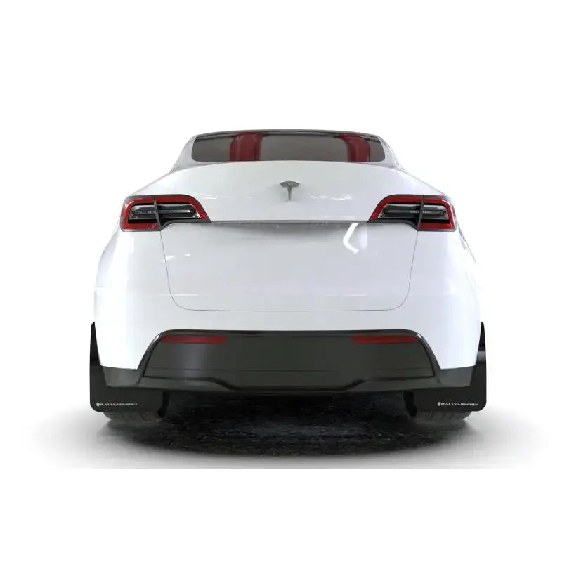 White Tesla Model Y rear view with Rally Armor mud flap and metallic black logo