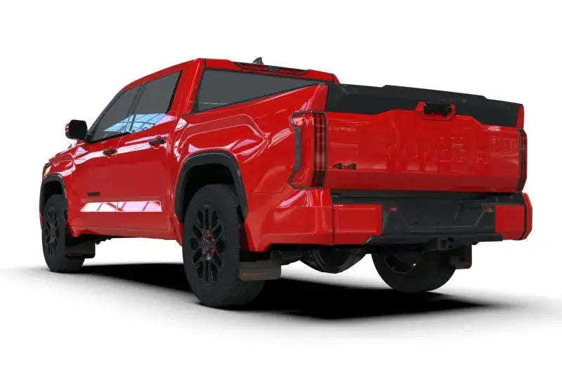 Red pickup truck with black trim and wheels showcasing Rally Armor 2022+ Toyota Tundra Black UR Mud Flap