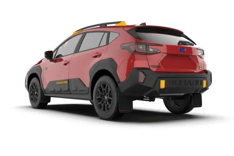 Red Subaru Crosstrek Wilderness with black accents and black UR mud flap featuring red logo