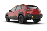 Red Subaru Crosstrek Wilderness with black accents and black UR mud flap featuring red logo