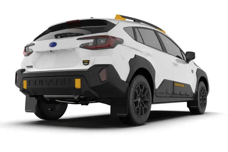 White Subaru Crosstrek Wilderness with black cladding and red logo UR mud flap