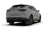 Rear view of light gray Ford Mustang Mach-E with black wheels and metallic black logo mud flaps