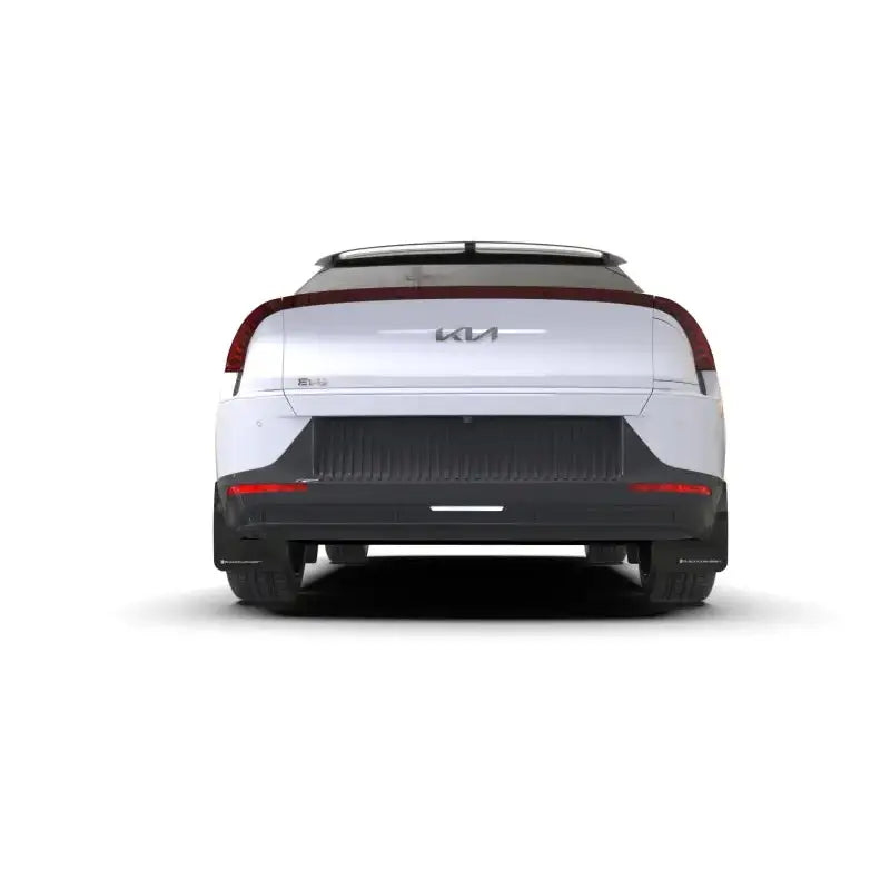 Rear view of a white Kia EV6 with Rally Armor mud flaps and black UR logo