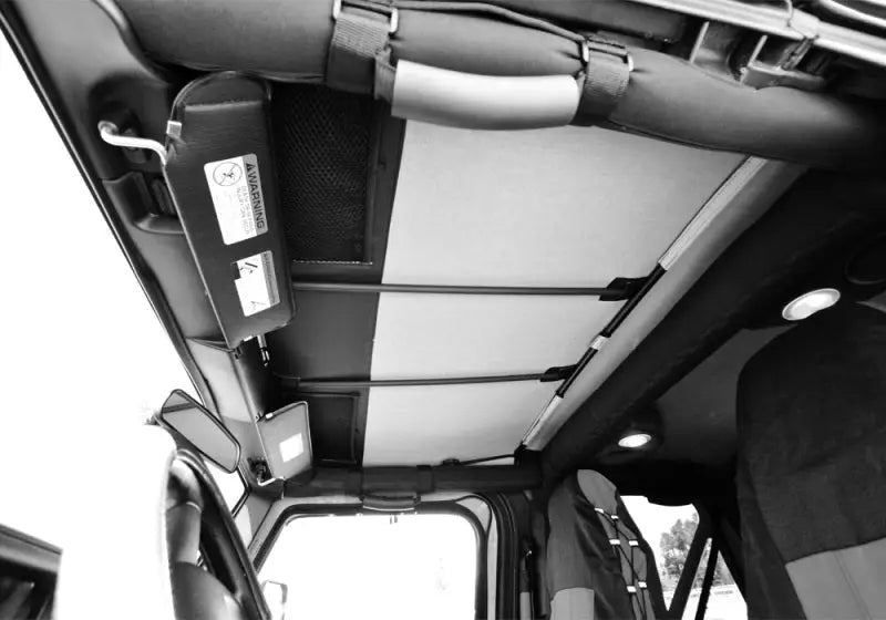 Rampage 1992-1995 Jeep Wrangler(YJ) Frameless Soft Top Kit - Black Diamond interior view showing snug fit over factory roll bar and storage panel for removable windows.