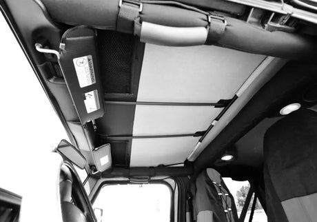 Rampage 1992-1995 Jeep Wrangler(YJ) Frameless Soft Top Kit - Black Diamond interior view showing snug fit over factory roll bar and storage panel for removable windows.