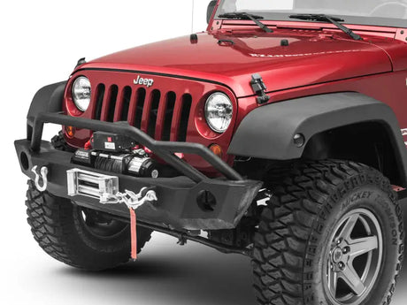 Red Jeep Wrangler with aftermarket bumper and winch showcasing Axial Series LED marker lights