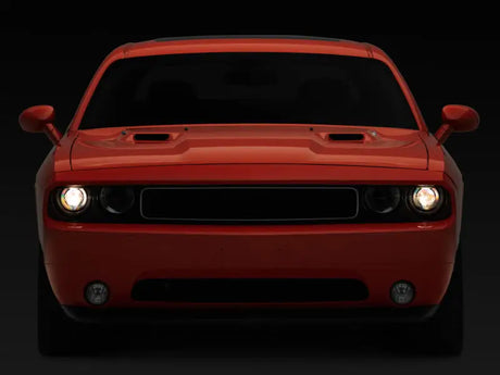 Red Dodge Challenger with halo projector headlights and sequential turn signals